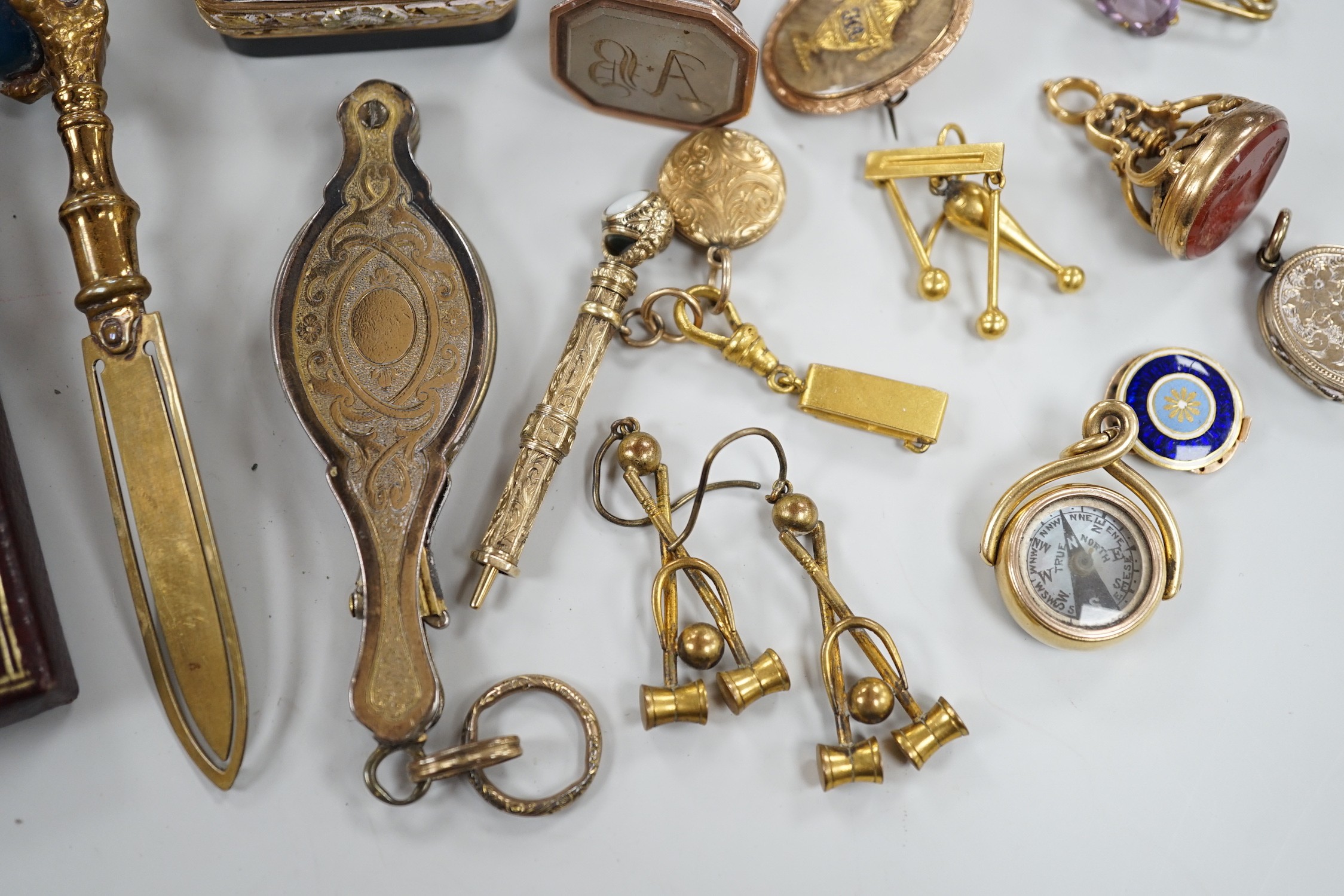 Mixed collectables including a yellow metal clam shell mourning pendant, 22mm, a George III yellow metal and plaited hair mourning brooch, with central urn and engraved inscription verso, three assorted 19th century and